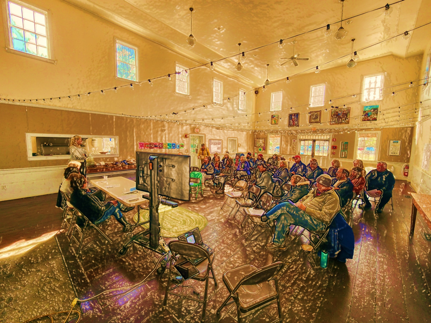 Community listening event with islanders gathered in a hall